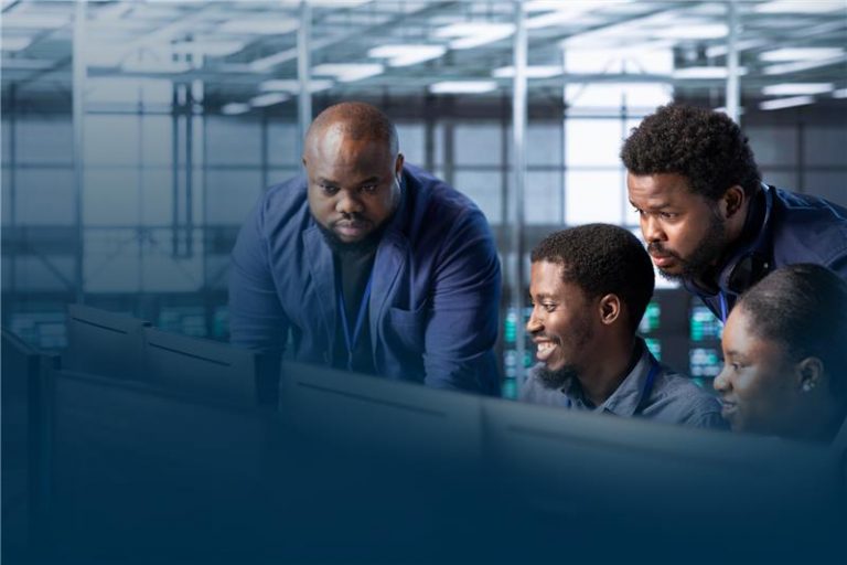 African software development team collaborating on a project, showcasing the benefits of outsourcing software development.